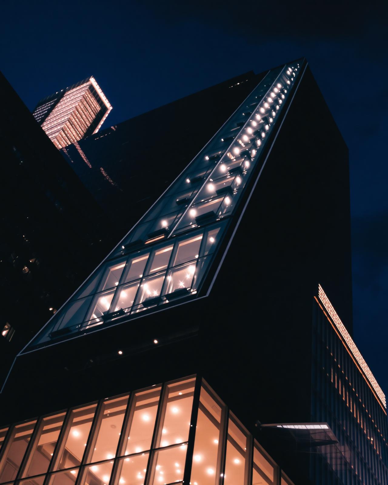 Modern glass tower at night